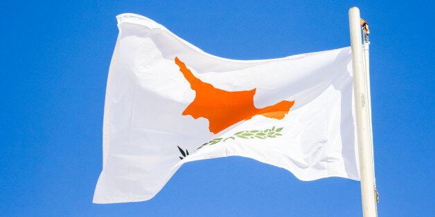 Waving flag of Cyprus on the blue sky background, Agia Napa