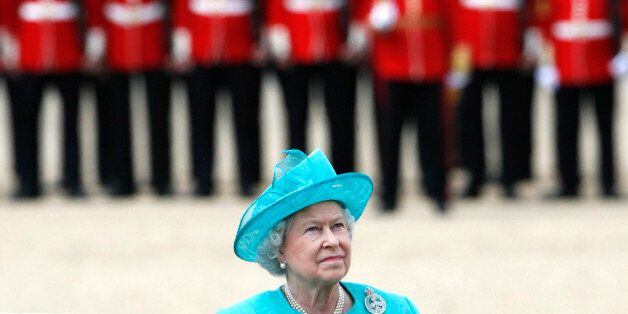 Britain's Queen Elizabeth attends the Trooping the Colour ceremony in London June 14, 2008. Trooping the Colour has honoured the sovereign's official birthday since the 17th century, and dates back to the earliest times of armed conflict when each leader needed his own flag or colours to stand out clearly amid the smoke and dust of battle, which led to regular trooping allowing soldiers to recognise the colours around which they should rally. REUTERS/Luke MacGregor (BRITAIN)