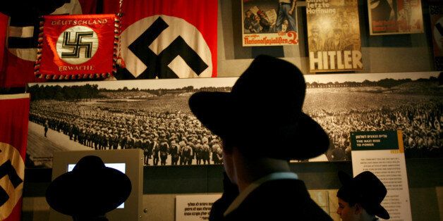 Ultra-Orthodox Jewish men visit the Yad Vashem Holocaust Museum in Jerusalem April 24, 2006. Israel marks the annual memorial day commemorating the six million Jews killed in the Holocaust of World War II on Monday. REUTERS/Gil Cohen Magen