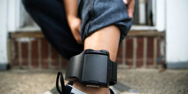 Ana Martinez, 32, shows her immigration monitoring bracelet that she wears on her ankle at her apartment in Huntington, New York September 21, 2015. Picture taken on September 21. REUTERS/Shannon Stapleton