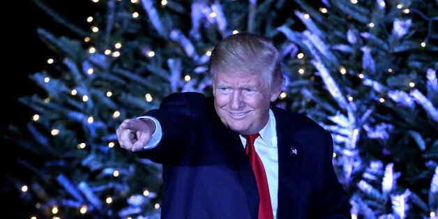 President-elect Donald Trump responds to cheering supporters in front of a Christmas-themed backdrop at a rally in Orlando, Fla., on Friday, Dec. 16, 2016. (Joe Burbank/Orlando Sentinel/TNS via Getty Images)