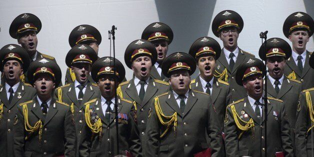 A picture taken on October 23, 2015 shows the official army choir of the Russian armed forces, also called Alexandrov Ensemble, performing at the Palais des Sports in Paris. AFP PHOTO/JACQUES DEMARTHON (Photo credit should read JACQUES DEMARTHON/AFP/Getty Images)