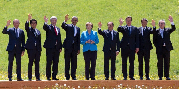 GARMISCH-PARTENKIRCHEN, GERMANY - JUNE 07: (From L to R) President of the European Council Donald Tusk, Japanese Prime Minister Shinzo Abe, Canada's Prime Minister Stephen Harper, U.S. President Barack Obama, German Chancellor Angela Merkel, French President Francois Hollande, British Prime Minister David Cameron, Italian Prime Minister Matteo Renzi and President of the European Commission Jean-Claude Juncker pose at the group photo at the summit of G7 nations at Schloss Elmau on June 7, 2015 near Garmisch-Partenkirchen, Germany. In the course of the two-day summit G7 leaders are scheduled to discuss global economic and security issues, as well as pressing global health-related issues, including antibiotics-resistant bacteria and Ebola. Several thousand protesters have announced they will seek to march towards Schloss Elmau and at least 17,000 police are on hand to provide security. (Photo by Carl Court/Getty Images)