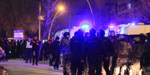 Turkish police officers secure the area close to a photo gallery where the Russian Ambassador to Turkey, Andrei Karlov, was shot by a gunman in Ankara, Turkey, Monday, Dec. 19, 2016. A Russian official says that the country's ambassador to Turkey has died after being shot by a gunman in Ankara. (IHA photo via AP)