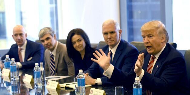 (L-R) Amazon's chief Jeff Bezos, Larry Page of Alphabet, Facebook COO Sheryl Sandberg, Vice President-elect Mike Pence and President-elect Donald Trump at Trump Tower December 14, 2016.Trump is meeting with top tech executives -- including several of his sharpest critics -- to mend fences after a divisive election in which the majority of Silicon Valley backed Hillary Clinton. / AFP / TIMOTHY A. CLARY (Photo credit should read TIMOTHY A. CLARY/AFP/Getty Images)