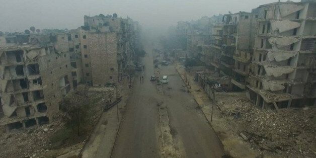 A still image from video taken December 13, 2016 of a general view of bomb damaged eastern Aleppo, Syria in the rain. Video released December 13, 2016. REUTERS/via ReutersTV