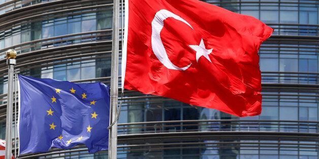 A European Union (L) and Turkish flag fly outside a hotel in Istanbul, Turkey, May 4, 2016. REUTERS/Murad Sezer/File Photo