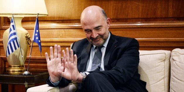 European Commissioner for Economic and Financial Affairs Pierre Moscovici reacts during a meeting with Greek Prime Minister in his office in Athens, on November 28, 2016. / AFP / LOUISA GOULIAMAKI (Photo credit should read LOUISA GOULIAMAKI/AFP/Getty Images)