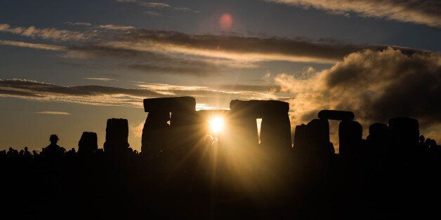 This is a sunset at stonehenge the night of the summer solstice