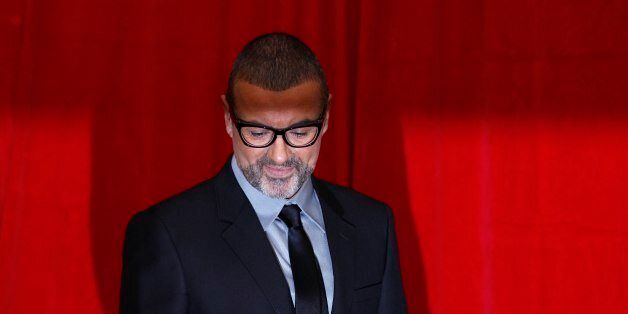 British singer George Michael poses for photographers before a news conference at the Royal Opera House in central London May 11, 2011. REUTERS/Stefan Wermuth (BRITAIN - Tags: ENTERTAINMENT)