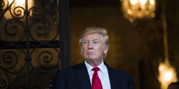 PALM BEACH, FL - DECEMBER 21: President-Elect Donald J. Trump looks out after a meeting with military leadership at the Mar-a-Lago club in Palm Beach, FL on Wednesday, Dec. 21, 2016. (Photo by Jabin Botsford/The Washington Post via Getty Images)