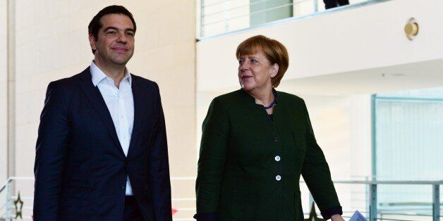 BERLIN, GERMANY - DECEMBER 16: German Chancellor Angela Merkel (R) and Greek Prime Minister Alexis Tsipras (L) hold a joint press conference after their meeting in Berlin, Germany on December 16, 2016. (Photo by Maurizio Gambarini/Anadolu Agency/Getty Images)