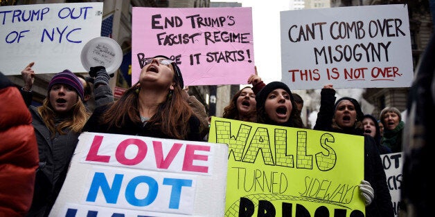 Protesters against U.S. President-elect Donald Trump shout slogans while demonstrating near Trump Tower in the Manhattan borough of New York, U.S. November 20, 2016. REUTERS/Mark Kauzlarich