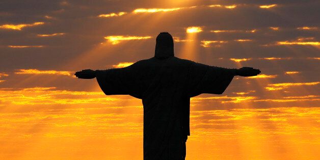 Christ the Redeemer during sunrise in Rio de Janeiro, Brazil, August 2, 2016. REUTERS/Kai Pfaffenbach