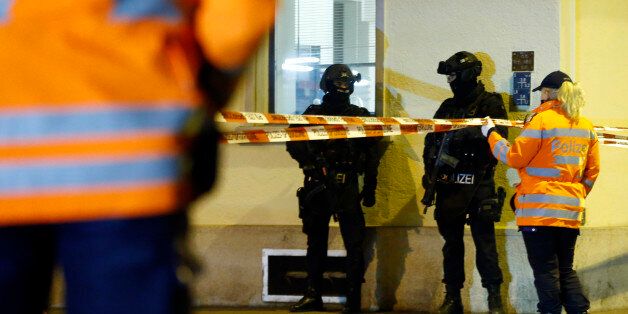 Police stand outside an Islamic center in central Zurich, Switzerland December 19, 2016. REUTERS/Arnd Wiegmann