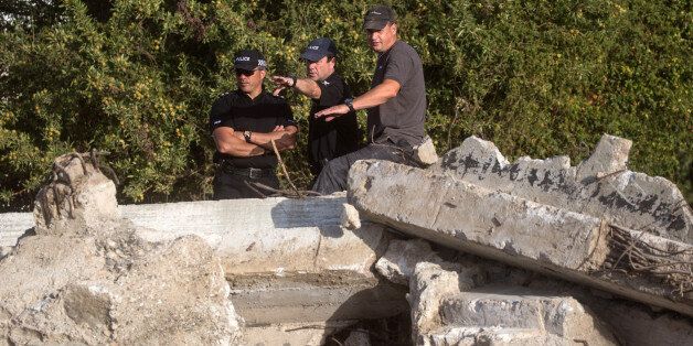 KOS, GREECE - OCTOBER 08: South Yorkshire Police officers look over the new second search site approximately 1km from the farmhouse search site of missing toddler Ben Needham on October 8, 2016 in Kos, Greece. The 21 month old toddler from Sheffield vanished on the Greek island in July of 1991. A 19-strong team of police officers, forensic specialists and an archaeologist have been searching an olive grove next to the farm for the past twelve days and have now begun work on a second site, where