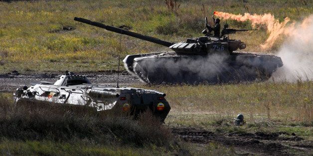 CHEBARKUL, RUSSIA - SEPTEMBER 27: Russian army tanks participate in the Center-2011 military exercises September 27, 2011 in Chebarkul, Chelyabinks region, Russia. According to reports September 27, 2011, Russian President Dmitry Medvedev said that if anyone in government questioned his plan to boost defense spending must work elsewhere. The Russian President fired the Finance Minister Alexei Kudrin September 26, after criticizing his military budget publicly. (Photo by Sasha Mordovets/Getty Images)