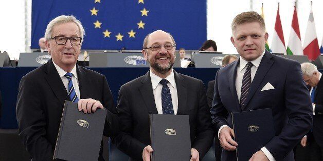 European Commission's President Jean-Claude Juncker (L), European Parliament President Martin Schulz (C) and Slovakian Prime Minister Robert Fico pose after the signature of the joint declaration on the EU's legislative priorities for 2017, on December 13, 2016 at the European Parliament in Strasbourg, eastern France. / AFP / FREDERICK FLORIN (Photo credit should read FREDERICK FLORIN/AFP/Getty Images)