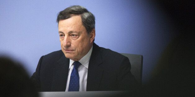 Mario Draghi, president of the European Central Bank (ECB), looks on during a news conference to announce the bank's interest rate decision at the ECB headquarters in Frankfurt, Germany, on Thursday, Dec. 8, 2016. The ECB expanded its quantitative-easing program to exceed 2.2 trillion euros ($2.4 trillion) by the end of 2017, buying at a reduced the monthly pace with the caveat that it can step up or prolong purchases if needed. Photographer: Alex Kraus/Bloomberg via Getty Images