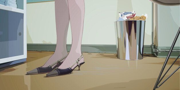 An illustration of a womans feet and lower legs standing in an office environment drawn from a low a