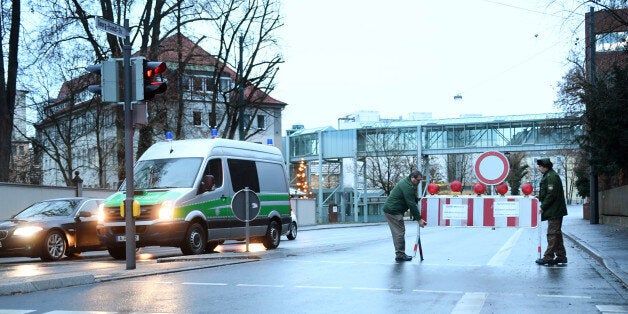 Policemen place a road block in Augsburg, southern Germany, on December 25, 2016.Around 54,000 residents are being evacuated from their homes. It is Germany's biggest evacuation for an unexploded bomb since the end of the World War Two.The lettering reads: 'Danger zone. Do Not Enter' / AFP / dpa / Tobias Hase / Germany OUT (Photo credit should read TOBIAS HASE/AFP/Getty Images)