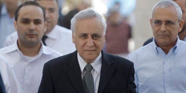 JERUSALEM, ISRAEL - NOVEMBER 10: (ISRAEL OUT) Former Israeli President Moshe Katsav (C), arrives at Israel's Supreme Court to hear the verdict of his appeal on rape and other sexual offences on November 10, 2011, in Jerusalem, Israel. Israel's Supreme Court today rejected Katsav's appeal against his seven-year jail term for rape and other sexual offences. (Photo by David Vaaknin/Getty Images)
