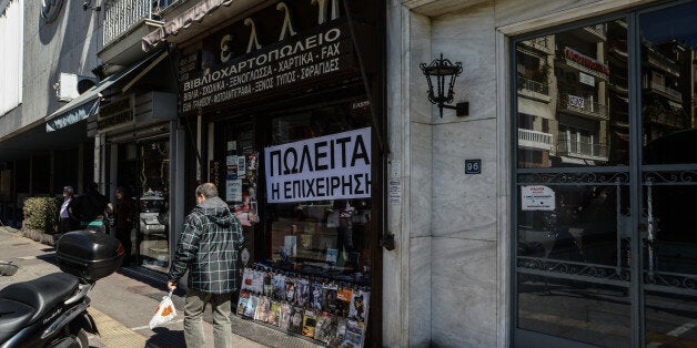 Shopowners protesting by selling their shops because of the presence of refugees living Victoria Square in Athens, Greece, on March 5, 2016. The customers are not able to come to the shops (Photo by Wassilios Aswestopoulos/NurPhoto) (Photo by NurPhoto/NurPhoto via Getty Images)