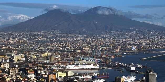 A picture taken from a terrace shows Naples' bay and the Vesuvius volcano on January 9, 2016 in Naples. AFP PHOTO / GABRIEL BOUYS / AFP / GABRIEL BOUYS (Photo credit should read GABRIEL BOUYS/AFP/Getty Images)