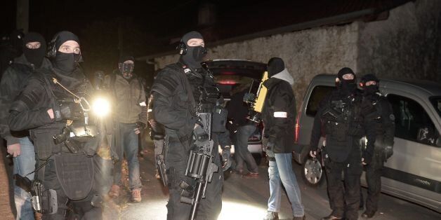 French police officers of the RAID and the Judiciary Police (PJ) secure the area after a French and Spanish police operation against the Basque separatist group ETA in Louhossoa, near Bayonne, overnight on December 16, 2016. / AFP / STR / IROZ GAIZKA (Photo credit should read IROZ GAIZKA/AFP/Getty Images)