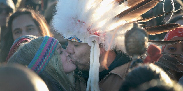 CANNON BALL, ND - DECEMBER 04: Native American and other activists celebrate after learning an easement had been denied for the Dakota Access Pipeline at Oceti Sakowin Camp on the edge of the Standing Rock Sioux Reservation on December 4, 2016 outside Cannon Ball, North Dakota. The US Army Corps of Engineers announced today that it will not grant an easement to the Dakota Access Pipeline to cross under a lake on the Sioux Tribes Standing Rock reservation, ending a months-long standoff. (Photo by Scott Olson/Getty Images)