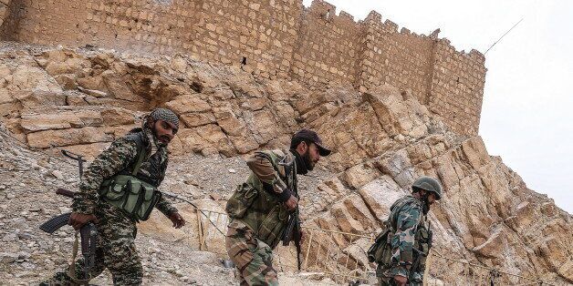 PALMYRIA, SYRIA. MARCH 26, 2016. Soldier of the Syrian government army near Fakhr al-Din al-Maani Citadel in Palmyra, a UNESCO world heritage site. The Syrian Government's army is fighting with ISIS militants for control of the heritage site. Valery Sharifulin/TASS (Photo by Valery Sharifulin\TASS via Getty Images)