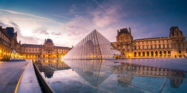 This photo of Louvre museum was taken during the sunrise of september. The pool water reflect their beautiful lights and architecture.