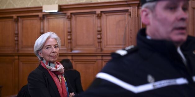 IMF chief Christine Lagarde is pictured in the courtroom at the Paris courthouse on December 12, 2016 prior to the start of her trial before the Court of Justice of the Republic, a special tribunal used to try ministers.IMF chief Christine Lagarde goes on trial in France on December 12 over a massive state payout to a flamboyant tycoon when she was finance minister in a case that risks tarnishing her stellar career. / AFP / Martin BUREAU (Photo credit should read MARTIN BUREAU/AFP/Getty Images)