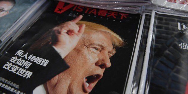 A magazine featuring US President-elect Donald Trump is seen at a bookstore in Beijing on December 12, 2016. The headline reads 'How will businessman Trump change the world'. Beijing is 'seriously concerned' by US president-elect Donald Trump's suggestion that he could drop Washington's One China policy unless the mainland makes concessions on trade and other issues, it said on December 12. / AFP / GREG BAKER (Photo credit should read GREG BAKER/AFP/Getty Images)