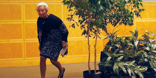 International Monetary Fund (IMF) Managing Director Christine Lagarde ducks beneath a decorative plant after delivering opening remarks at the IMFâs 17th Jaques Polak Annual Research Conference in Washington November 3, 2016.REUTERS/Kevin Lamarque