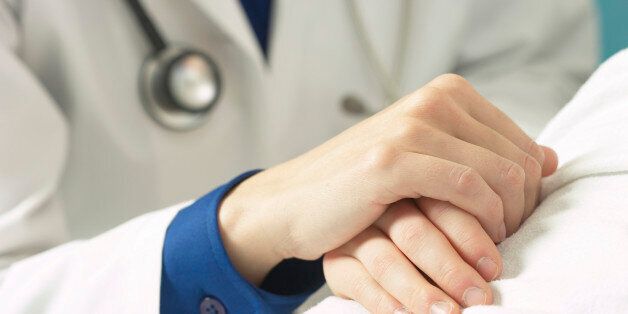 Doctor Holding Patient's Hand
