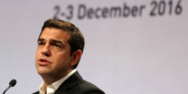 Greek Prime Minister Alexis Tsipras delivers a speech during the closing ceremony of an international conference on protecting the world's cultural heritage on December 3, 2016, in Abu Dhabi. / AFP / KARIM SAHIB (Photo credit should read KARIM SAHIB/AFP/Getty Images)