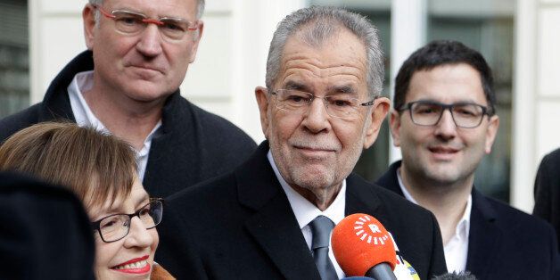 Alexander Van der Bellen, candidate of the Austrian Greens, briefs the media besides his wife Doris Schmidauer after leaving a polling station and casting their votes in Vienna, Austria, Sunday, Dec. 4, 2016. Austria holds presidential elections in a contest pitting a left-leaning contender against a right-winger supported by a populist anti-immigration party. (AP Photo/Matthias Schrader)