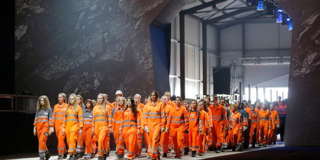 Artists perform during the opening show directed by German director Volker Hesse, on the opening day of the Gotthard rail tunnel, the longest rail tunnel in the world, at the fairground Rynaecht at the northern portal in Erstfeld, Switzerland, on June 1, 2016. The new Gotthard Base Tunnel (GBT) is set to become the world's longest railway tunnel when it opens on June 1. The 57-kilometre (35.4-mile) tunnel, which runs under the Alps, was first conceived in sketch-form in 1947 but construction began 17 years ago. / AFP / POOL / PETER KLAUNZER (Photo credit should read PETER KLAUNZER/AFP/Getty Images)