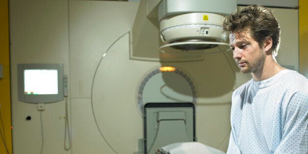 Young male patient sitting in radiology room