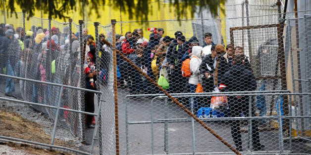 Migrants wait to cross the border from Slovenia into Spielfeld in Austria, February 16, 2016. REUTERS/Leonhard Foeger