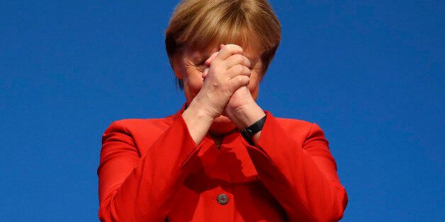 German Chancellor and leader of the conservative Christian Democratic Union party CDU Angela Merkel reacts after her speech at the CDU party convention in Essen, Germany, December 6, 2016. REUTERS/Kai Pfaffenbach