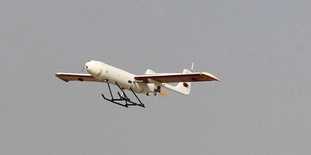 In this picture released by Jamejam Online on Thursday, Dec. 25, 2014, an Iranian made drone is launched during a military drill in Jask port, southern Iran. Iran's national army has begun a massive military drill near the strategic Strait of Hormuz at the entrance to the Persian Gulf, state TV reported on Thursday. (AP Photo/Jamejam Online, Chavosh Homavandi)