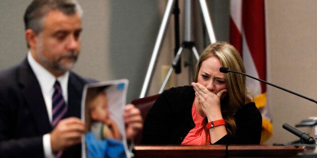 Leanna Taylor cries as defense attorney Maddox Kilgore shows the jury a picture of her son Cooper during a murder trial for her ex-husband Justin Ross Harris who is accused of intentionally killing Cooper in June 2014 by leaving him in the car in suburban Atlanta, Monday, Oct. 31, 2016, in Brunswick, Ga. (AP Photo/John Bazemore, Pool)