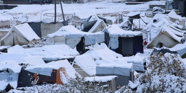 View of Petra refugee camp, located on the feet of Olympus mountain in northern Greece near the village Petra, Greece, on 3 December 2016. After the weather deteriorated in Greece there was snowfall around Greece and the temperature dropped below 0Â°C. It is a camp that hosted 450 Yazidi refugees from Iraq.The location is on Olympus mountain, the highest in Greece. The refugees were facing extreme hardship as blizzards hit region. During the summer to children died here, by getting drowned in a water reservoir as they went to play. The infrastructure is a former psychiatric clinic. Nowadays after they the very bad conditions and the media pressure the government moved them to state owned facilites like thermal bath hotels or rent temporary some hotel rooms in nearby cities. The camp is run by the greek army supported by UNHCR and various NGOs. (Photo by Nicolas Economou/NurPhoto via Getty Images)
