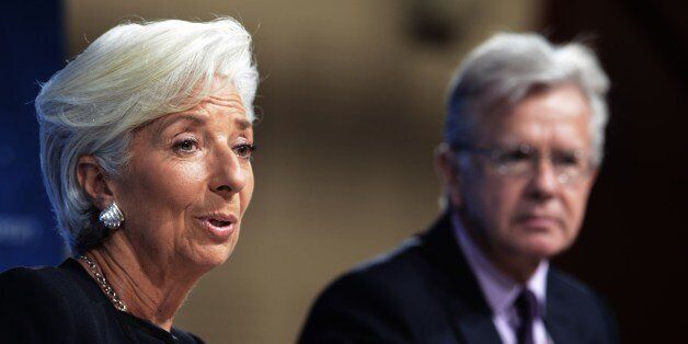 Christrine Lagarde (L) Managing Director of the IMF takes part in a briefing, accompanied by Gerry Rice IMF Director of the Communications Department, during the days activities of the Annual Meetings of the World Bank Group and International Monetary Fund on October 08, 2015. AFP PHOTO/CRIS BOURONCLE (Photo credit should read CRIS BOURONCLE/AFP/Getty Images)