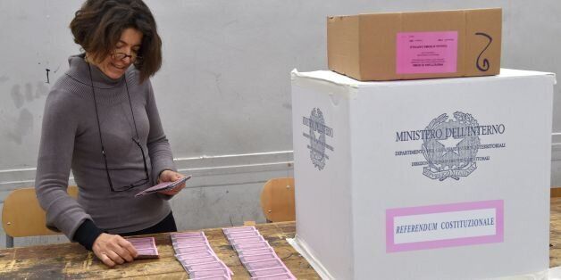 A polling station officer prepares ballots on the eve of a crucial referendum on constitutional reforms, on December 3, 2016 in Rome. At stake on December 4 referendum is whether to slash the size and powers of the second chamber Senate and transfer other powers from the regions to the national government. Italy's has had 60 different governments since the constitution was approved in 1948. / AFP / Andreas SOLARO (Photo credit should read ANDREAS SOLARO/AFP/Getty Images)