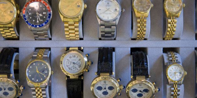 Confiscated fake watches are displayed during the German customs annual news conference in Berlin, March 12, 2015. REUTERS/Axel Schmidt (GERMANY - Tags: CRIME LAW BUSINESS POLITICS)