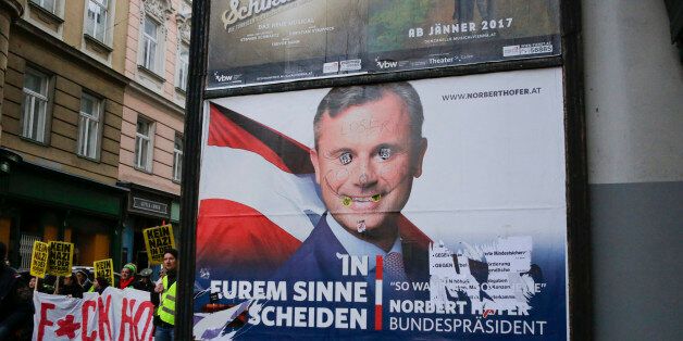 VIENNA, AUSTRIA - 2016/12/03: The protesters march past a defaced Norbert Hofer poster. Around a hundred protesters marched through Vienna one day ahead of the Austrian Presidential election, protesting against the rightwing candidate for the election, Norbert Hofer. (Photo by Michael Debets/Pacific Press/LightRocket via Getty Images)