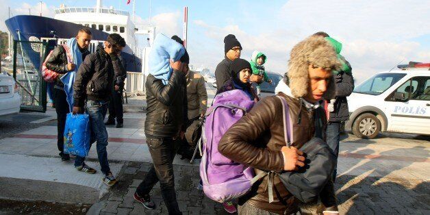 IZMIR, TURKEY - DECEMBER 07: Migrants are seen after being captured by Turkish gendarmes while trying to illegally reach Greece through the Aegean Sea with boats, at Cesme in Izmir, Turkey on December 07, 2016. Turkish gendarmes apprehended 116 foreigners suspected of getting ready to illegally migrate from Izmir, Turkeys western coastal province. (Photo by Denizhan Guzel/Anadolu Agency/Getty Images)
